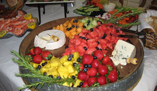 Fresh fruit platter with brie and a gorgonzola cheese