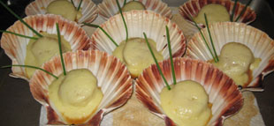 Goat cheese stuffed figs, wrapped in prosciutto... roasted with a honey balsamic drizzle